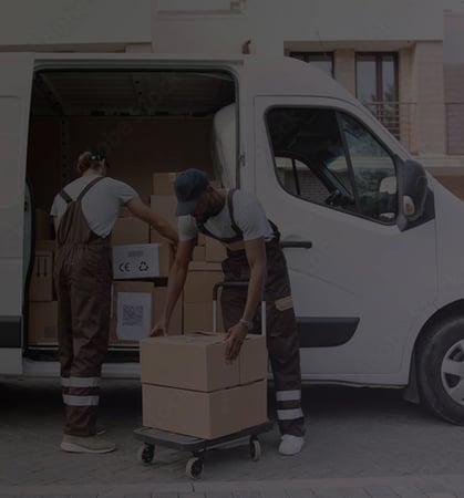 Delivery men unpacking white van