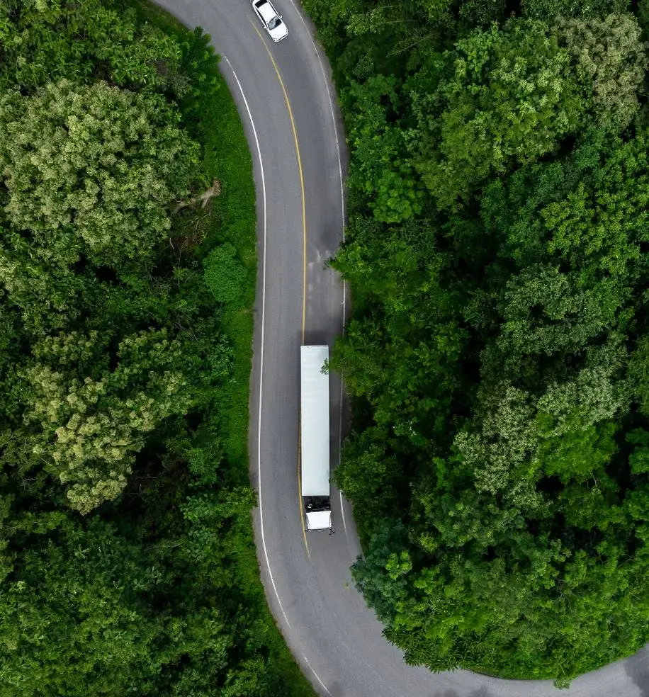 birds eye view of truck going down road